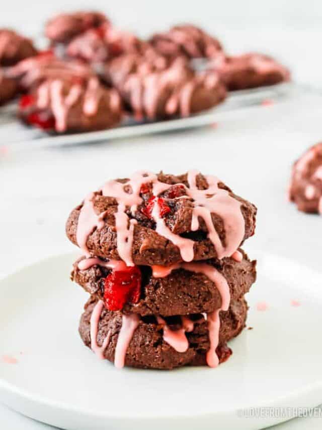 a stack of chocolate cookies with cherries