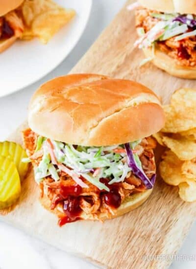 A bbq chicken sandwich topped with coleslaw