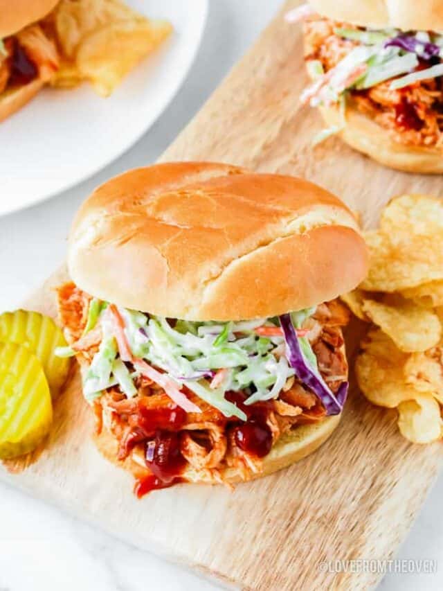 A bbq chicken sandwich topped with coleslaw