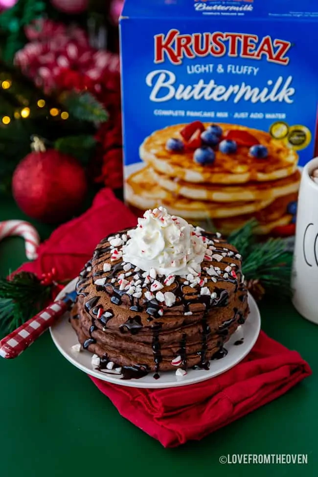 Chocolate pancakes with a box of Krusteaz pancake mix