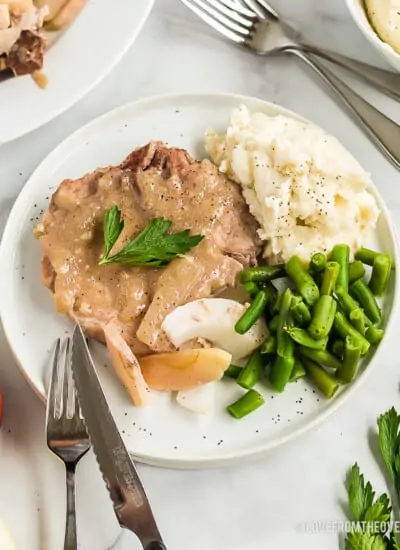 ranch pork chops on a plate with green beans