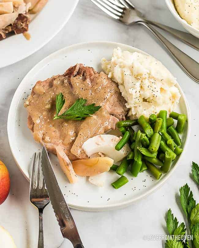 ranch pork chops on a plate with green beans