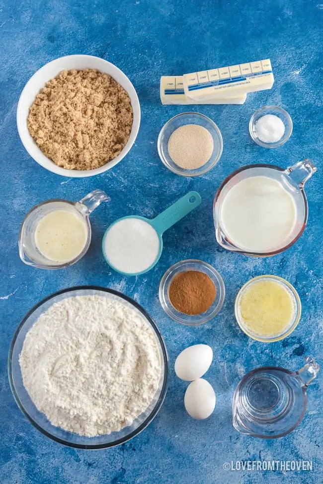 ingredients for cinnamon rolls on a blue background
