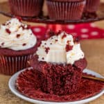 red velvet cupcake with a bite taken out of it