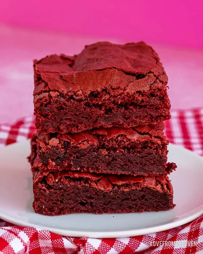 stack of red velvet bars with a pink background