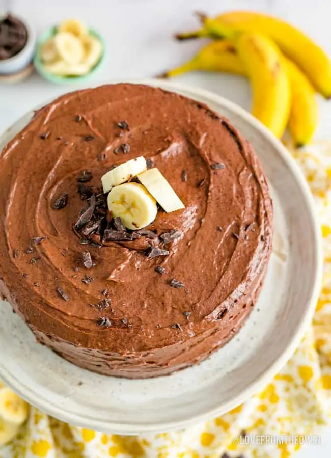 overhead shot of a banana cake with chocolate frosting