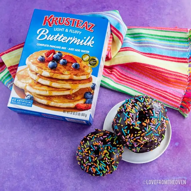 a stack of donuts and box of pancake mix
