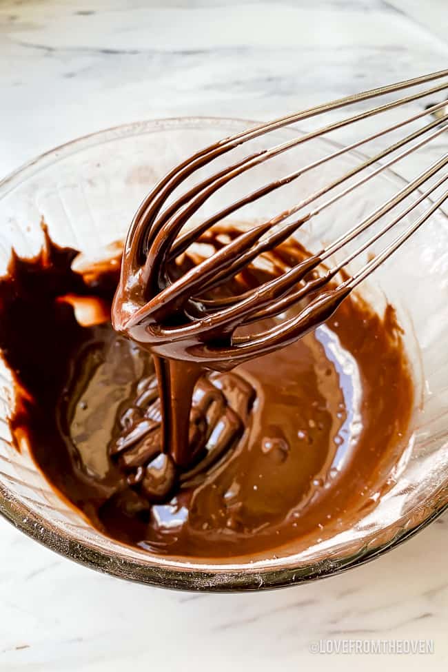 a bowl of chocolate donut glaze