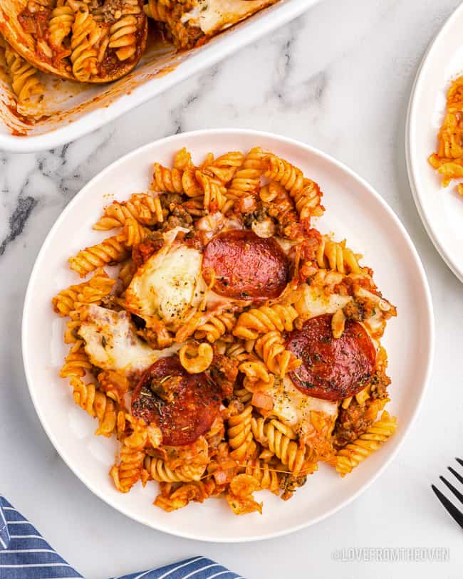 An overhead shot of a plate of pizza pasta