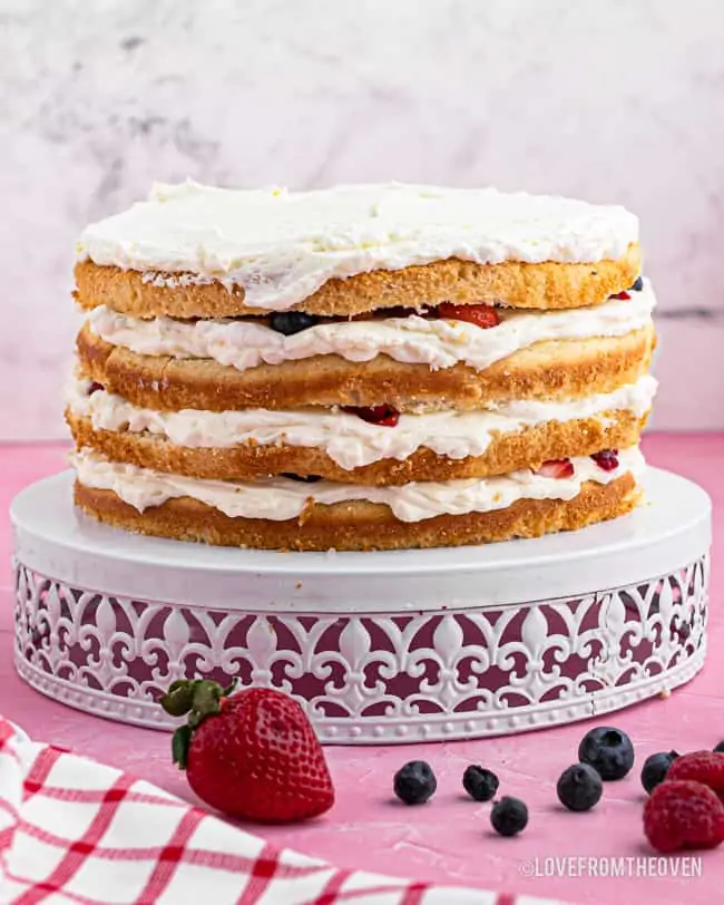 chantilly layer cake on a cake stand