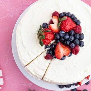 overhead photo of chantilly cake topped with berries