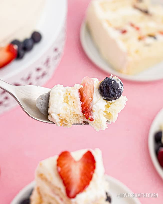 A bite of chantilly cake on a fork