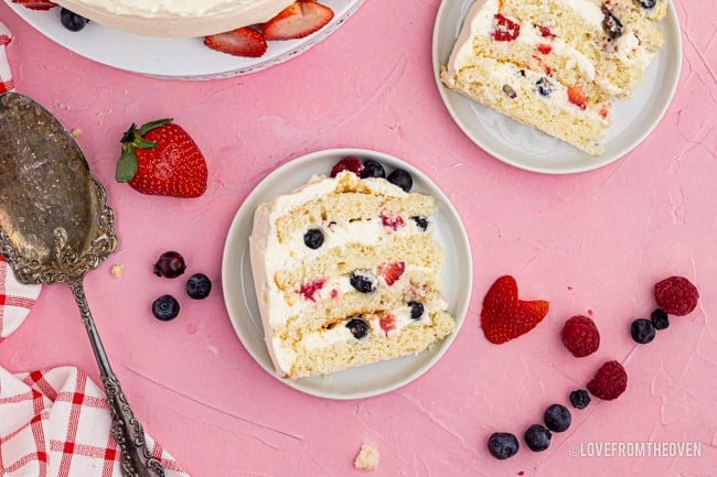 Overhead shot of slices of chantilly cake with fresh berries