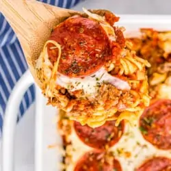 A spoonful of pizza casserole with pepperoni