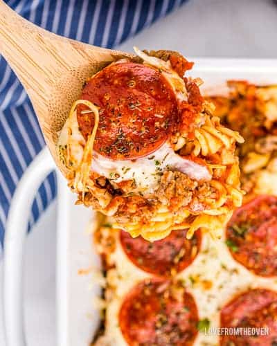 A spoonful of pizza casserole with pepperoni