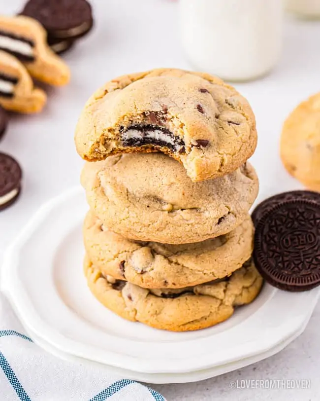A stack of chocolate chip cookies with oreos inside