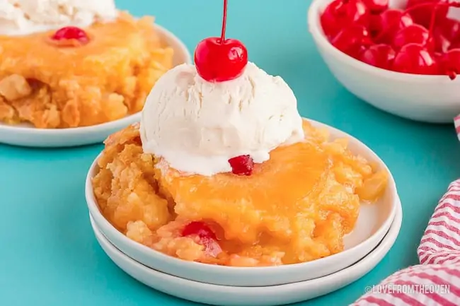 pineapple upside down topped with ice cream and a cherry