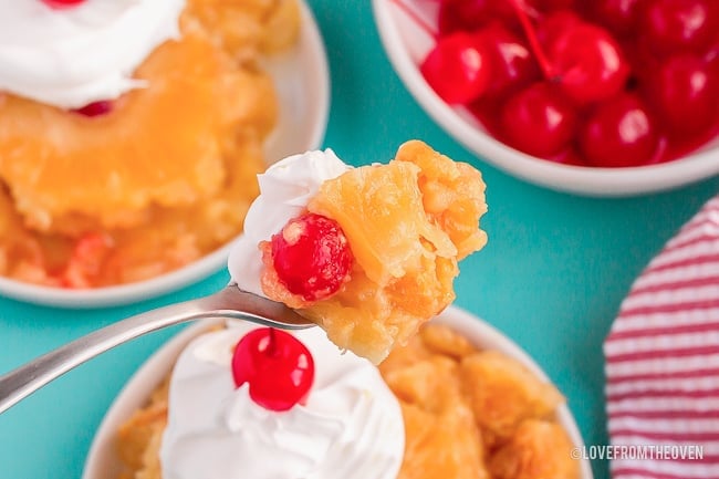 fork full of pineapple upside down cake