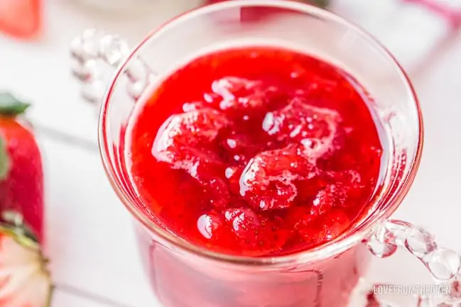 glass bowl of strawberry sauce