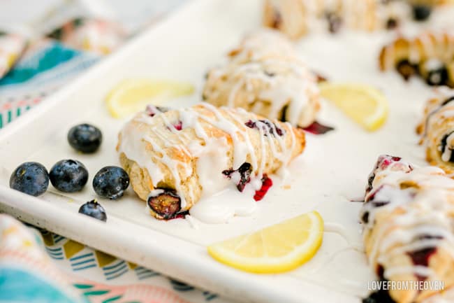 lemon blueberry scones with lemon slices and blueberries