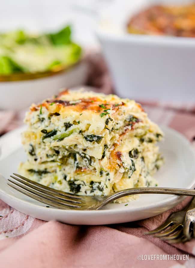 A serving of chicken alfredo lasagna on a plate