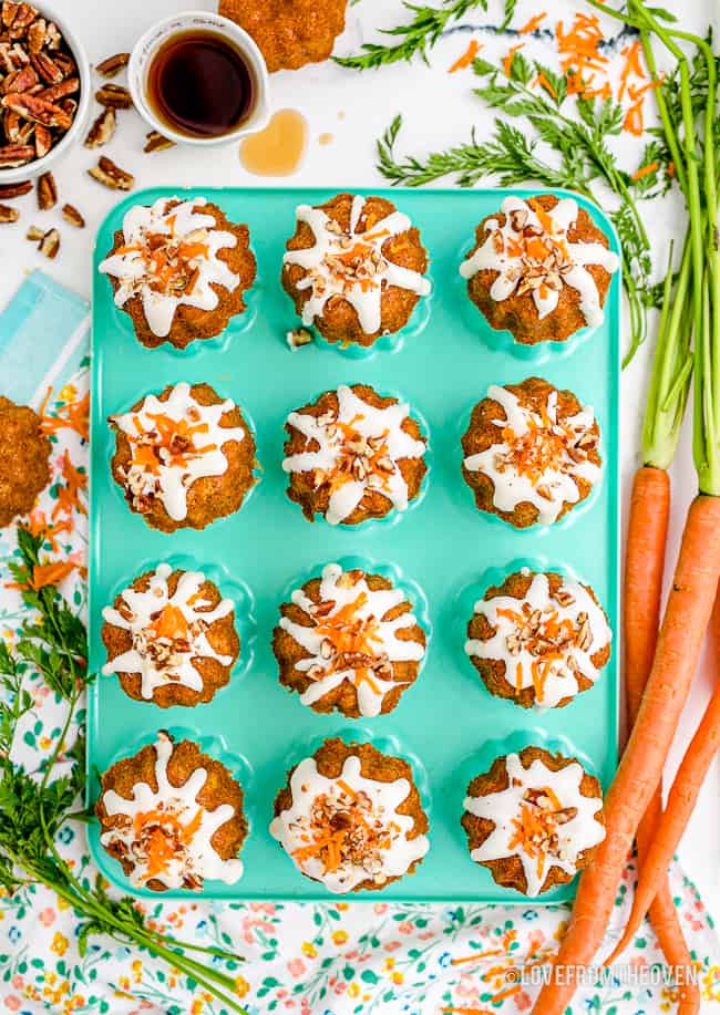 little carrot cakes on a aqua colored pan