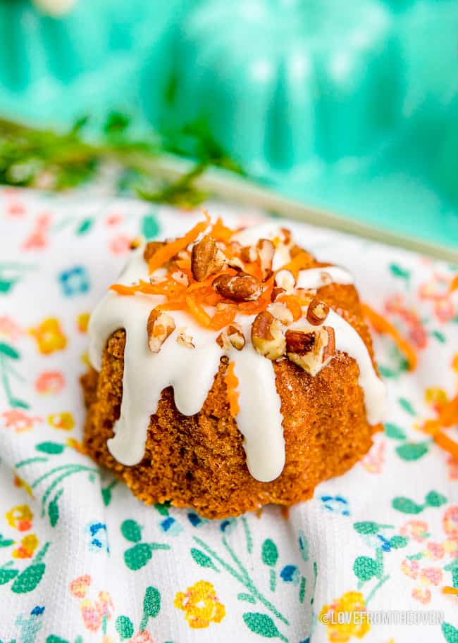 a mini carrot cake on a flower print napkin