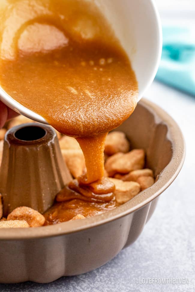 caramel being poured over monkey bread