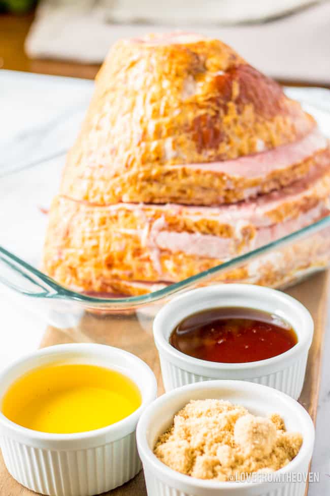 ingredients for a spiral ham glaze and an uncooked ham