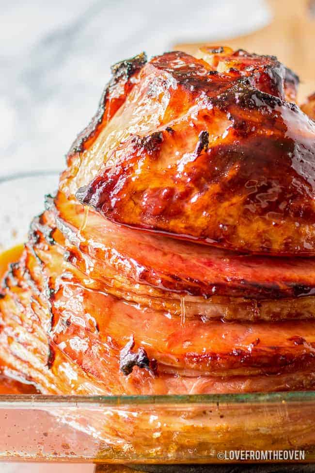 A close up photo of a spiral ham with brown sugar glaze