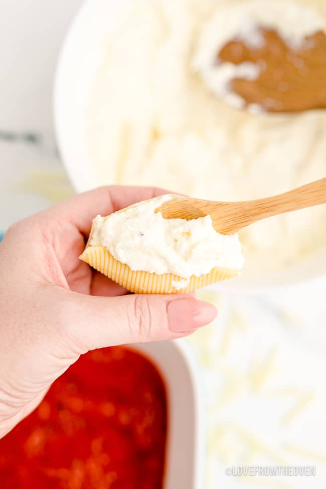 someone making stuffed shells