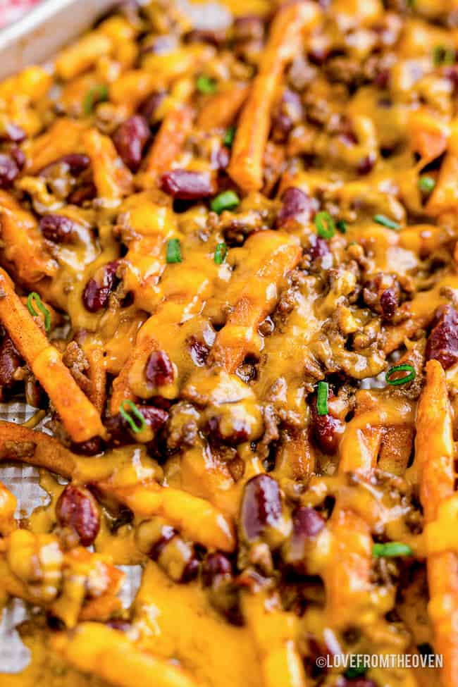a pan full of chili cheese fries