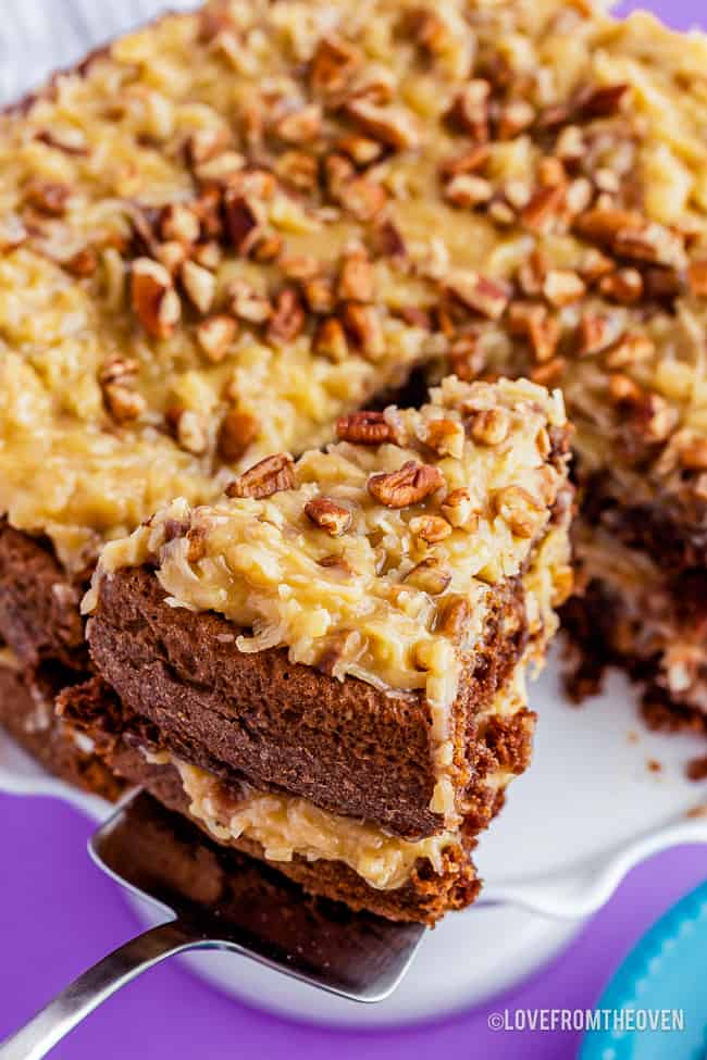 A slice of german chocolate cake with coconut pecan frosting