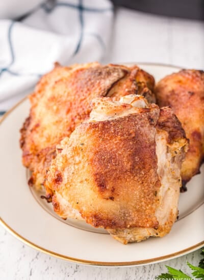 a plate of air fryer chicken thighs