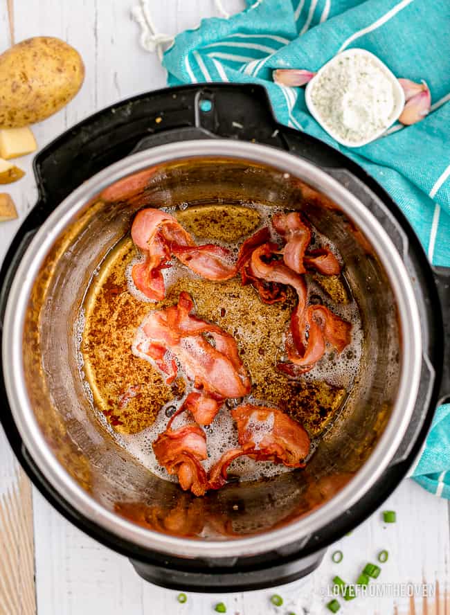 an instant pot with bacon in it