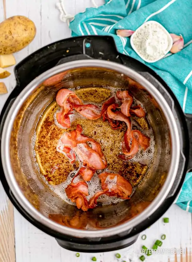an instant pot with bacon in it
