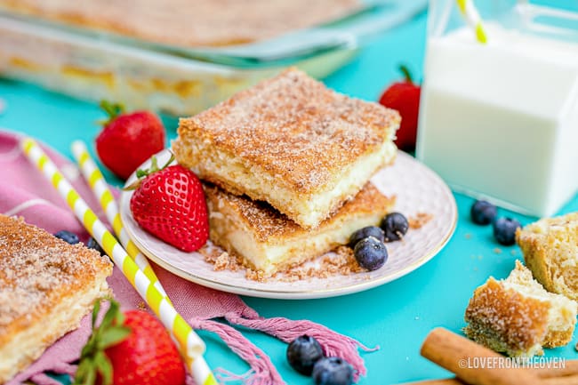 a plate of cheesecake bars