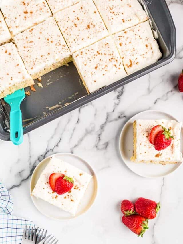overhead shots of a tres leches cake topped with strawberries