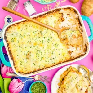 Scalloped potatoes on a pink background
