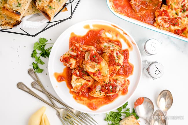 a plate of stuffed shells with marinara sauce