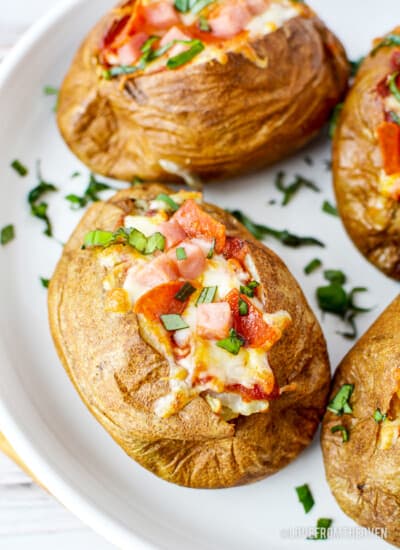 A plate of air fryer baked potatoes with toppings