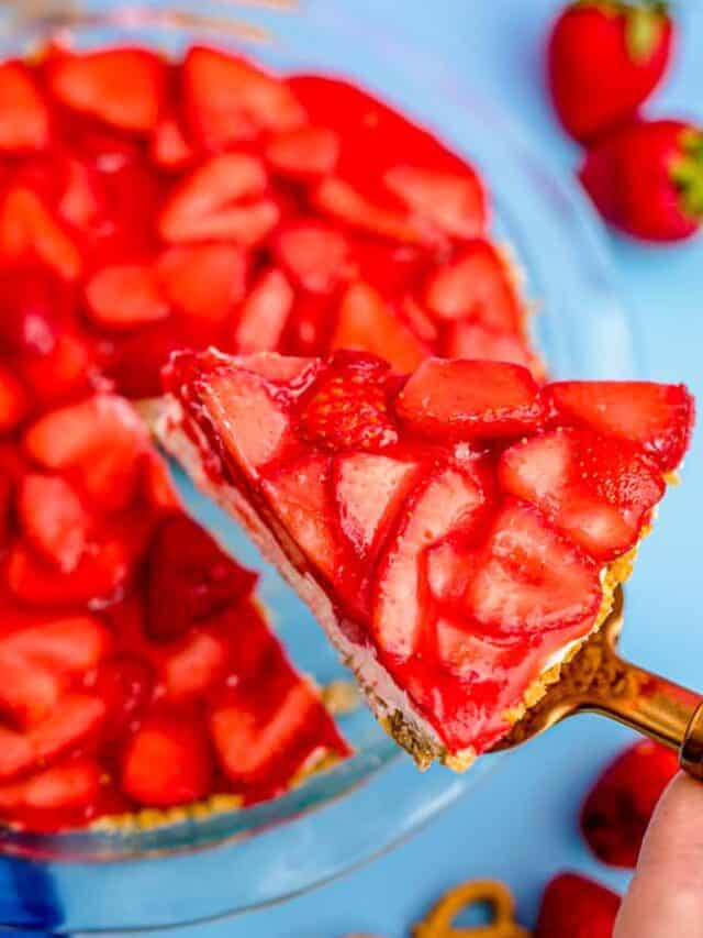 a strawberry pretzel jello pie with a slice being removed
