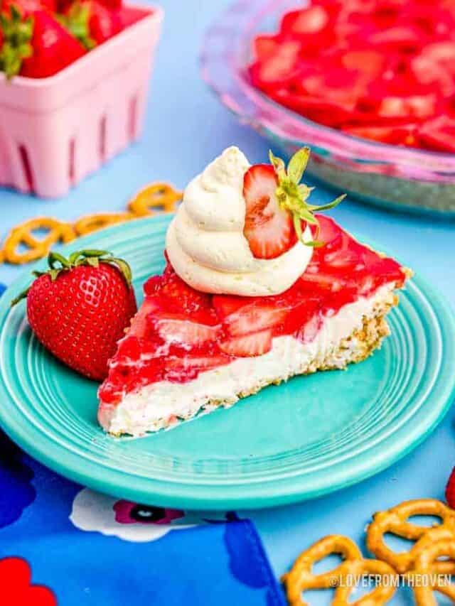 a slice of strawberry pretzel salad on a blue plate