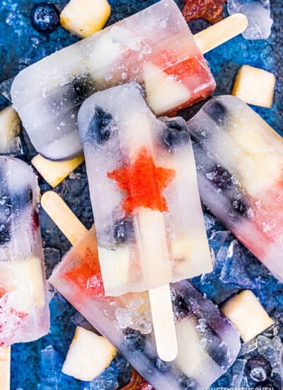 fruit popsicles on a blue background