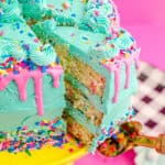 A funfetti cake being sliced