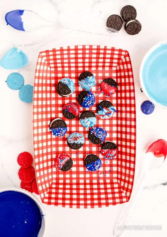 a red and white bowl with chocolate covered oreos