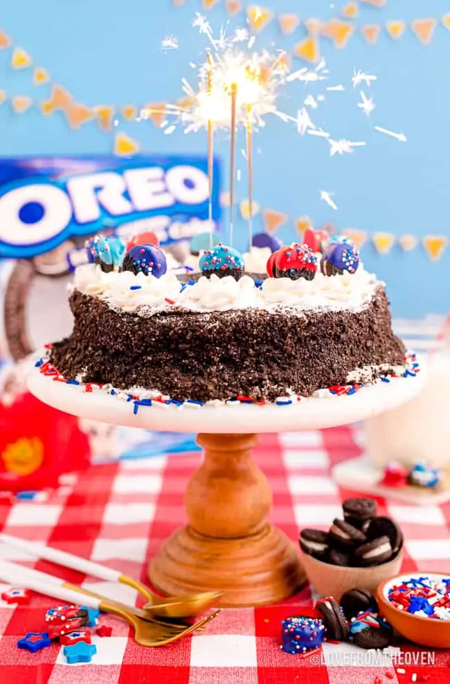 An oreo ice cream cake with sparklers on top.