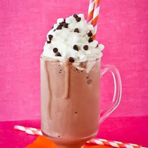 a frozen hot chocolate on a pink background