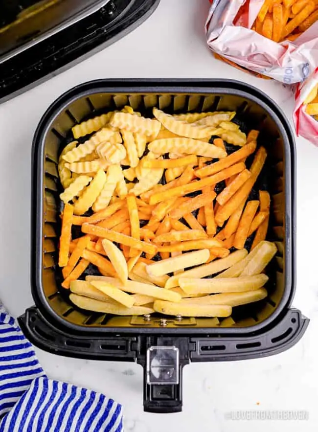 Frozen french fries in an air fryer.