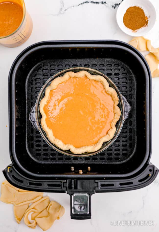 A pumpkin pie in an air fryer.